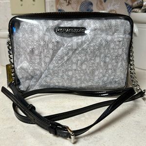 Michael Kors, Black patent trim & strap with clear front & back panels.